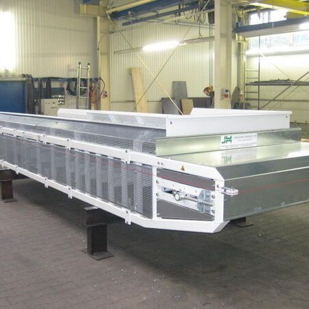 Plastic belt conveyor in dog food manufacturing